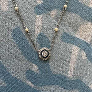 Beautiful sapphire/diamond looking necklace with pearls along the chain.